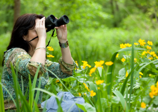 Woman looking through binoculars