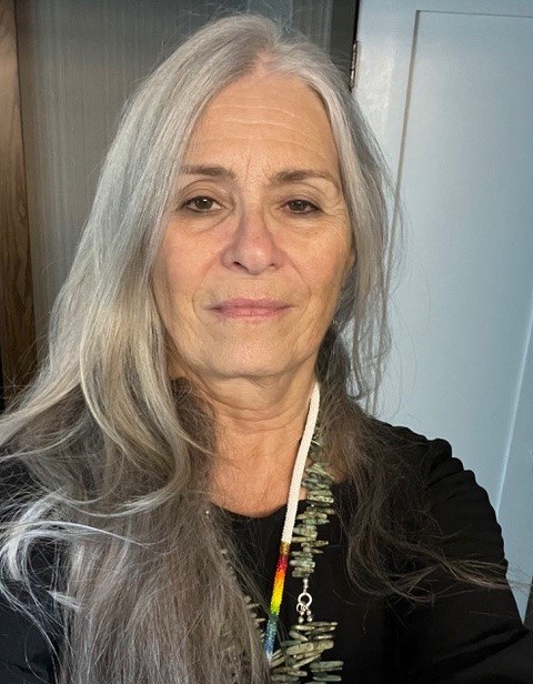 woman, long white/grey hair, wearing black top