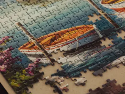 jigsaw puzzle of a canoe on the water.